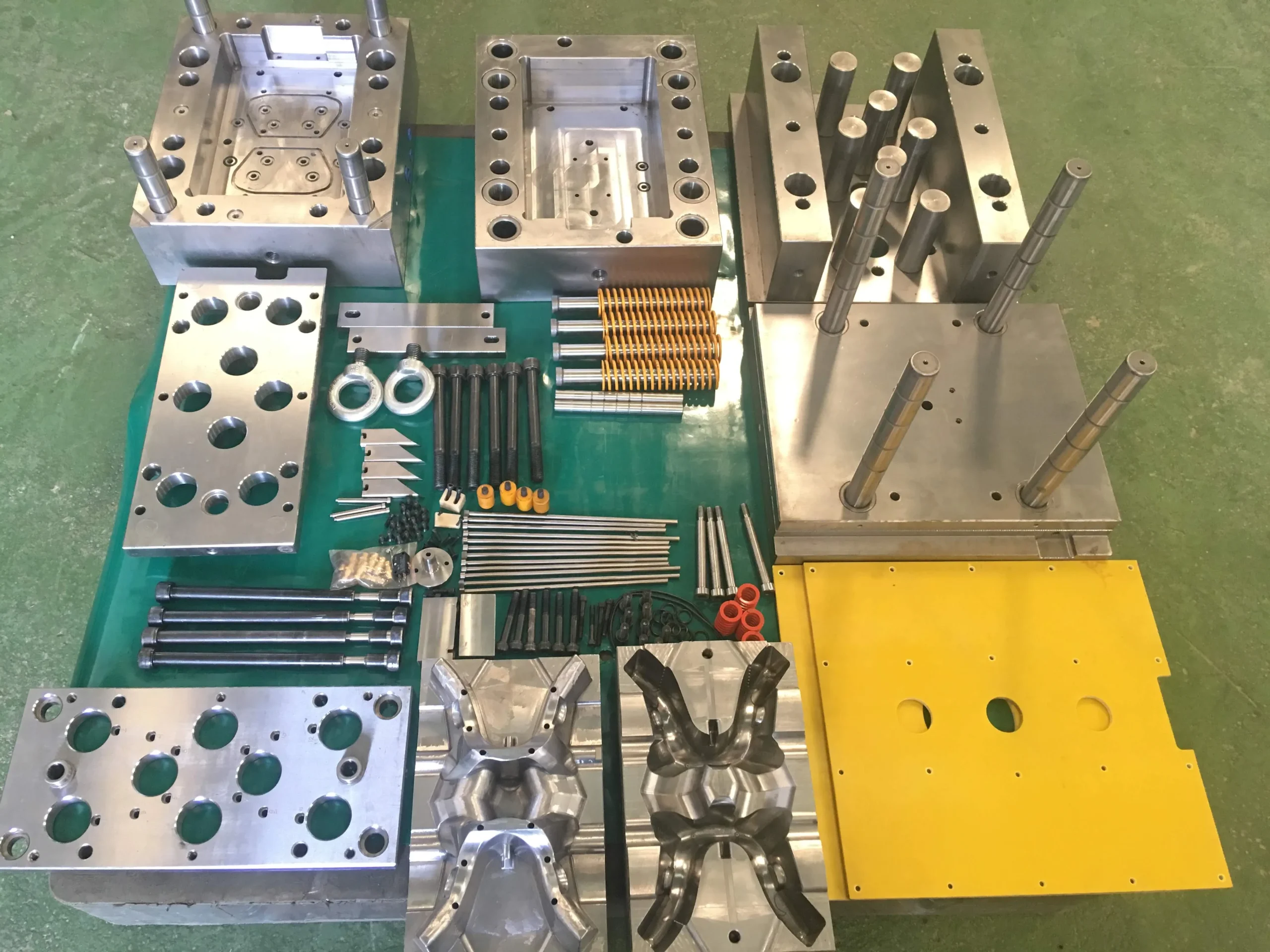 Plastic injection mould components prepared for assembly